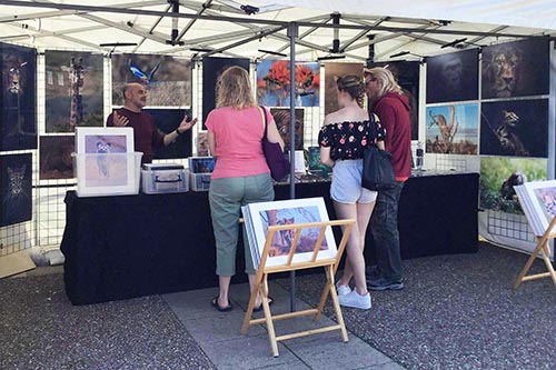 ashley vincent engaging with customer at the late May Eastbourne market