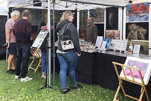 ashley vincent engaging with customers at the Milton Keynes Thai Festival