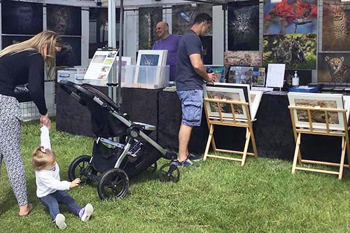 Ashley Vincent engaging with customers at the 2022 Poole Thai Festival