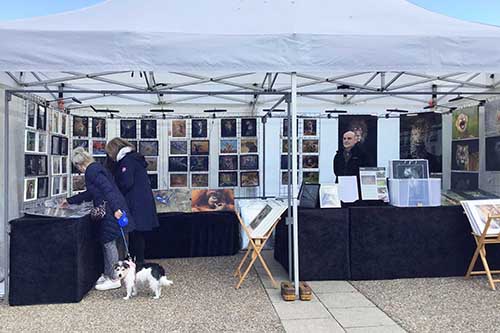 Ashley Vincent with customer at the April 2023 Eastbourne Easter Market