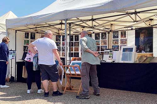 Ashley Vincent with customer at the May 2023 Eastbourne Whitsun Market