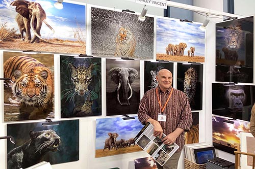 Ashley Vincent by his display stand at the 2024 Rochester Art Fair