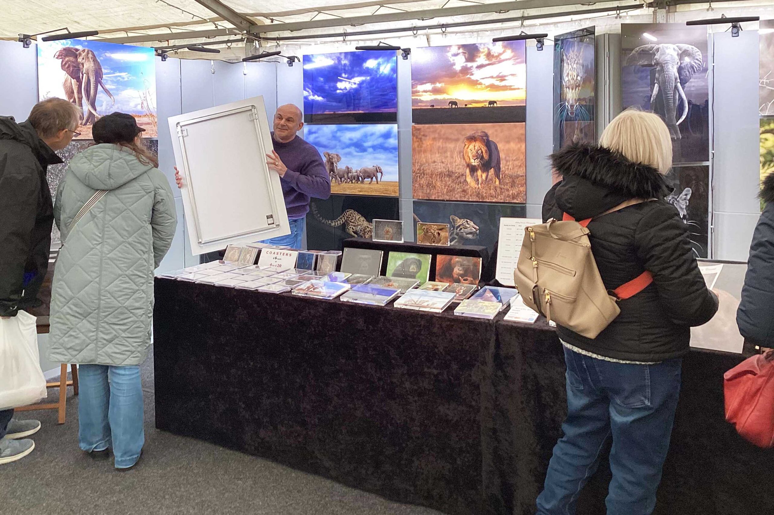 Ashley Vincent engaging with customer at the 2024 RHS Hyde Hall Christmas Gift & Craft Fair