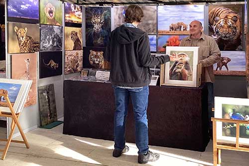 Ashley Vincent engaging with customer at the 2024 Milton Keynes Handmade & Vintage Winter Show
